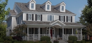 A large, white, Victorian style home