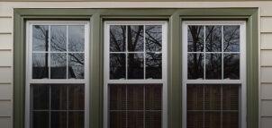 Three vinyl windows on a home