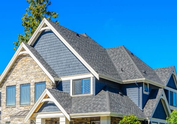 A large home with various types of siding